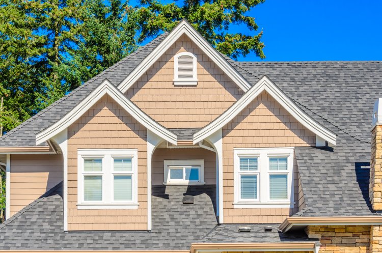 Close up of residential home with asphalt shingles